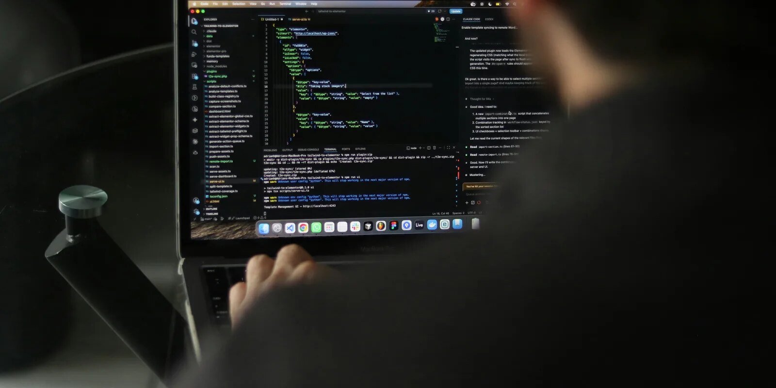Software developer writing code on a laptop computer